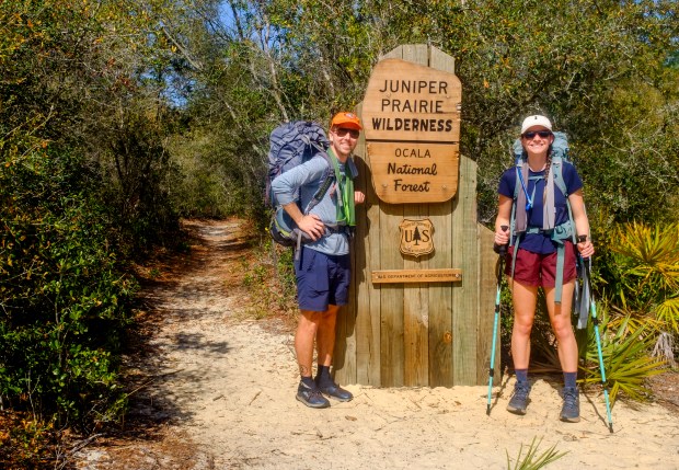 Patrick Connolly and Karissa Bellile enter the Juniper Prairie Wilderness while hiking the Florida Trail through Ocala National Forest on April 3, 2026. (Patrick Connolly/Orlando Sentinel)