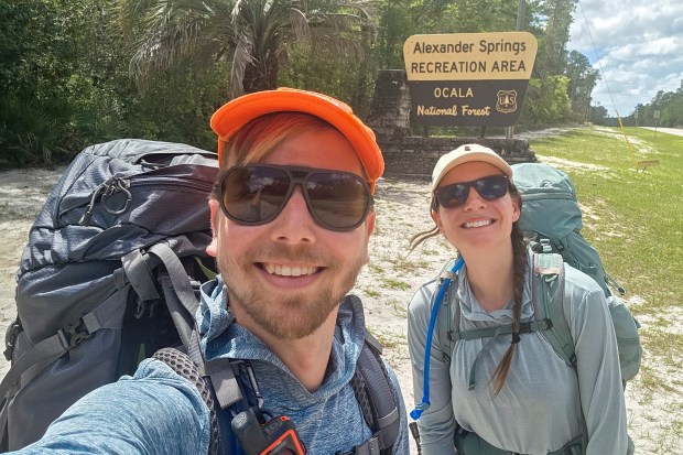 Patrick Connolly and Karissa Bellile begin their hike on the Florida Trail outside of Alexander Springs in Ocala National Forest on April 2, 2026. (Patrick Connolly/Orlando Sentinel)