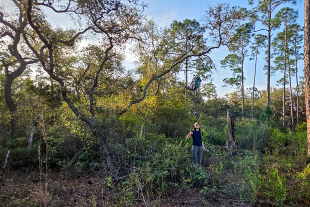 Karissa Bellile gives a thumbs up upon discovering that the bear bag was intact while hiking the Florida Trail through Ocala National Forest on April 3, 2026. (Patrick Connolly/Orlando Sentinel)