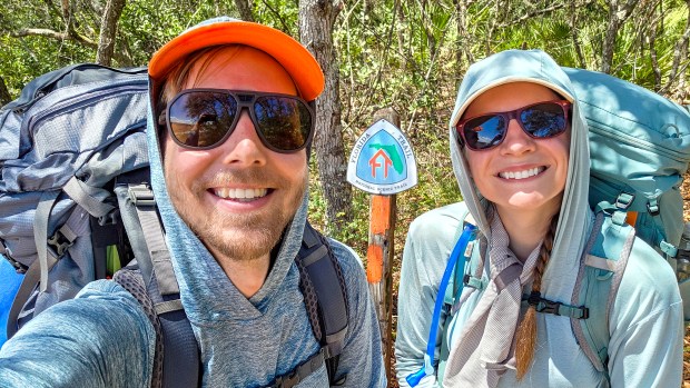 Patrick Connolly and Karissa Bellile pause for a trail selfie while hiking the Florida Trail through Ocala National Forest on April 4, 2026. (Patrick Connolly/Orlando Sentinel)