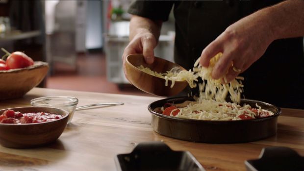 Mom may not want to stay out of the kitchen for Mother's Day, especially when she's learning to make pizza with her favorite people at Pizzeria Uno. (Photo courtesy Pizzeria Uno)