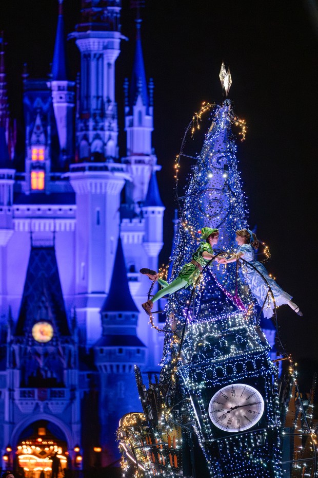 The nighttime parade at Magic Kingdom, 'Disney Starlight: Dream the Night Away,' is now showering viewers with a little extra faith, trust and pixie dust as Peter Pan and Wendy soar to new heights. Visitors may see the two take flight around their parade float during the performance. (Steven Diaz/Walt Disney Co.)