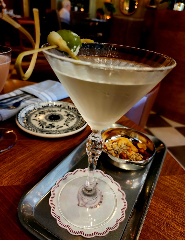 A killer martini was in the plans early on, says Sparrow owner Jason Chin. This house brine-infused beauty comes complete on its own silver tray with edible "bird seeds." (Amy Drew Thompson/Orlando Sentinel)