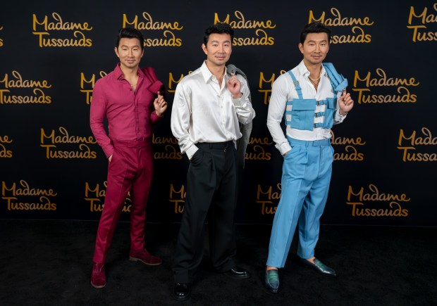Simu Liu of0ficially joined the A-list lineup at Merlin Entertainments' Madame Tussauds as the actor unveiled two new wax figures - one for Madame Tussauds New York and another for Madame Tussauds Orlando. Liu met and posed with his wax twins in New York City. Liu's Madame Tussauds Orlando figure features a rich mulberry-colored suit inspired by his look at the 2024 People's Choice Awards. The outfit includes a coordinating dress shirt worn open at the collar, matching dress shoes and socks, and accessories reflecting the actor's signature red carpet style. The Madame Tussauds New York figure is styled in a powder-blue Versace suit inspired by Liu's appearance at the Los Angeles premiere of "Barbie." (Madame Tussauds)