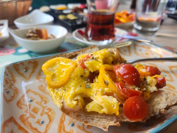 Menemen, a Turkish scrambled egg dish, is pictured atop a slice of fresh sourdough at Sourdough Bread House in Casselberry. (Amy Drew Thompson/Orlando Sentinel)