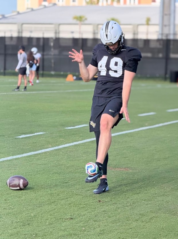 UCF punter Atticus Bertrams participated in a coordination drill during a recent practice during spring camp. Bertrams joined the Knights' roster after spending the past two seasons at Wisconsin. The Australian grew up with a passion for kicking a ball that followed him into sports such as soccer, rugby and Australian football. (Orlando Sentinel/Matt Murschel)