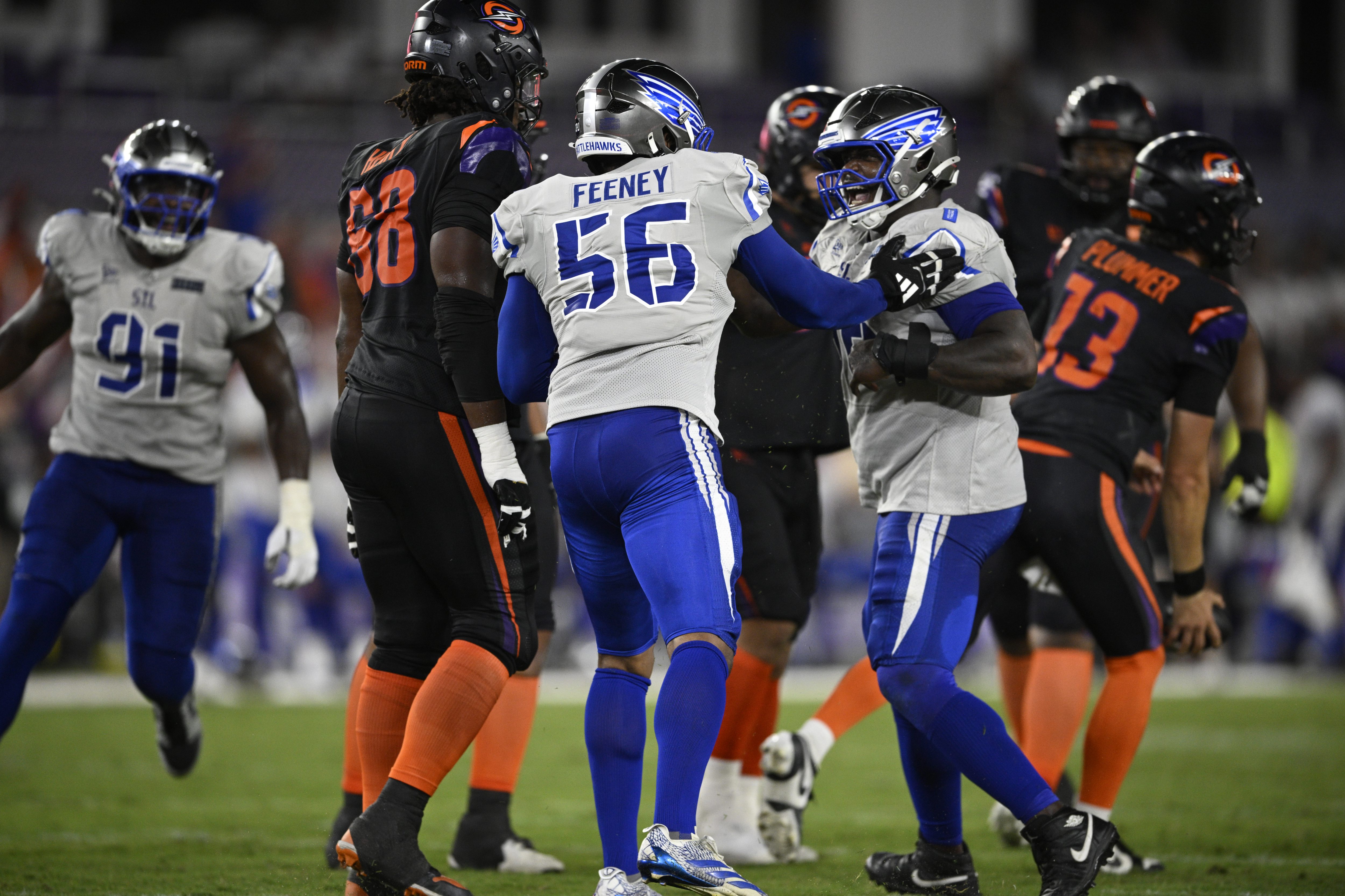 St. Louis Battlehawks linebacker Travis Feeney (56) congratulates nose tackle...