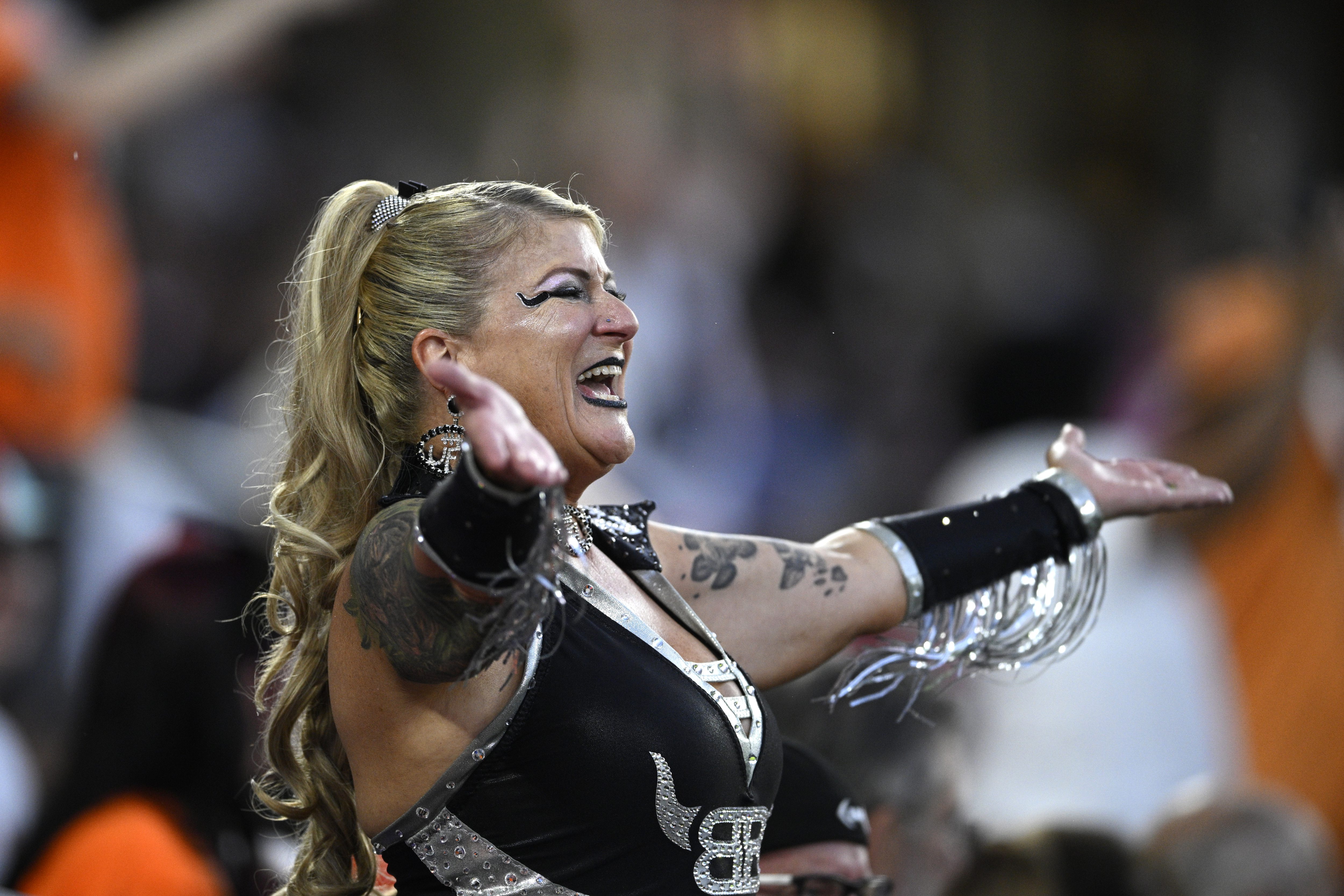 A fan cheers in the stands during a UFL football...