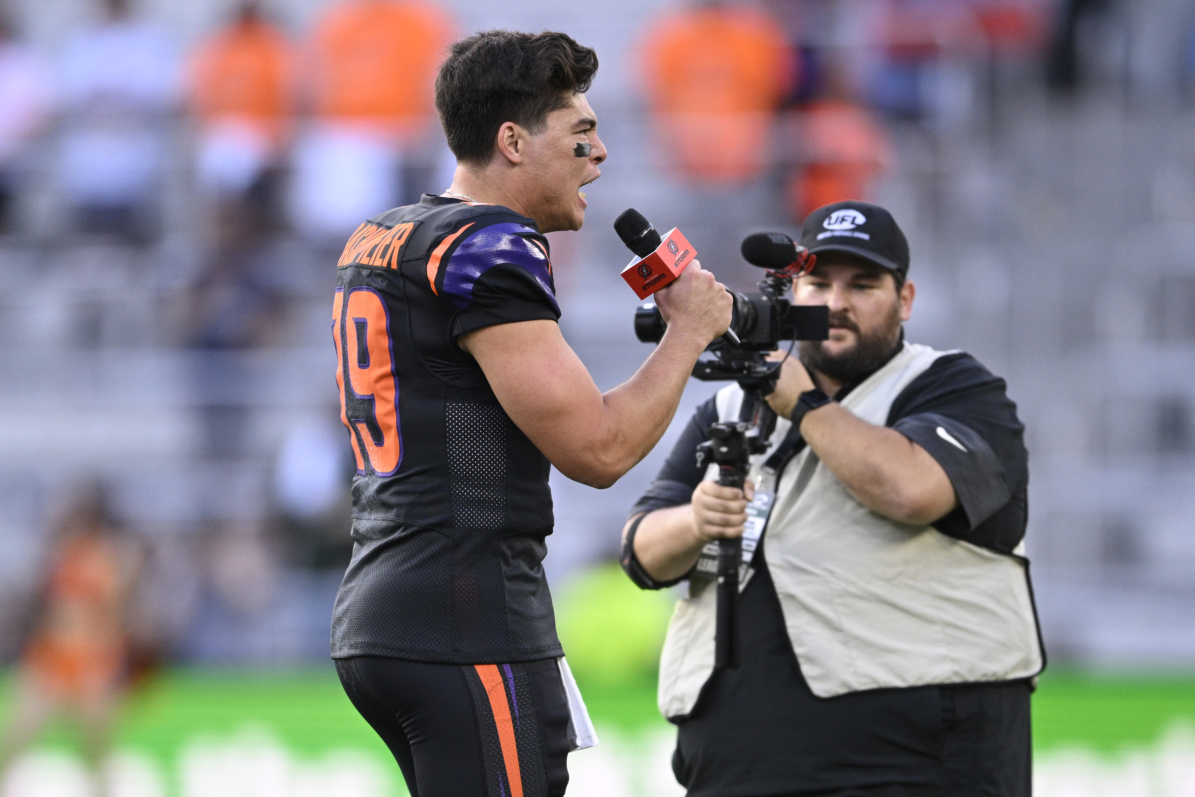 Orlando Storm quarterback Hank Bachmeier (19) pumps up the crowd...