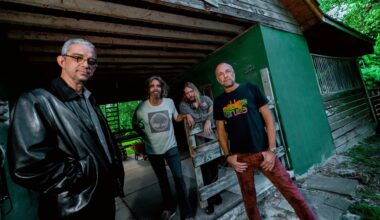 Photo of a band posing for the camera in Miami