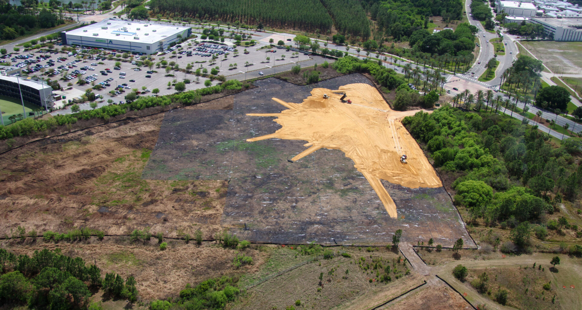 Mass land grading with sand along Universal Blvd near Epic Universe