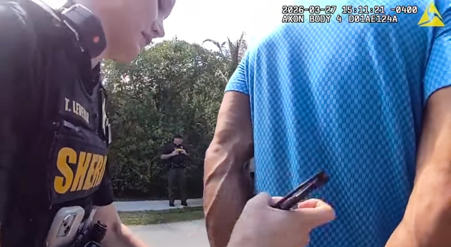 This image from body camera footage shows Woods being taken into custody by sheriff's deputies following a car crash.
