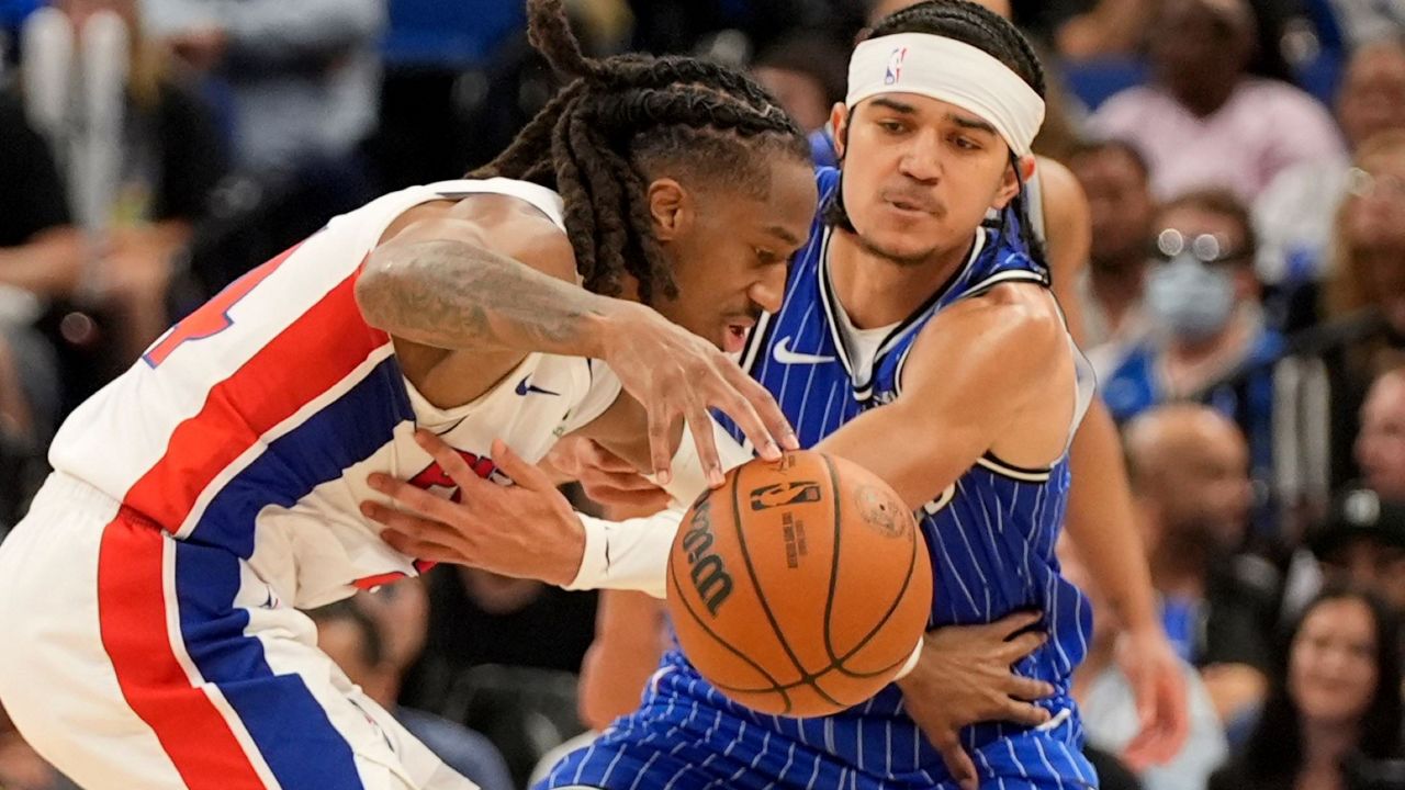 Magic guard Anthony Black (right) attempts to steal the ball from Pistons guard Daniss Jenkins on Monday, April 6, 2026, in Orlando, Fla. (AP Photo/John Raoux)