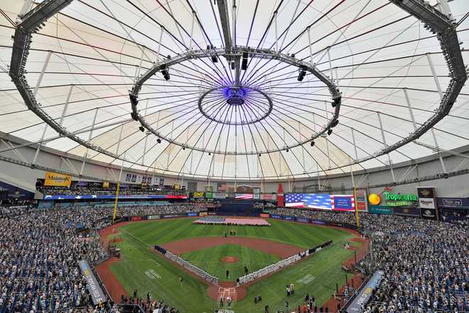 Country musician Eric Church sings the National Anthem before a baseball game between the Tampa Bay Rays and the Chicago Cubs Monday, April 6, 2026, in St. Petersburg, Fla. (AP Photo/Chris O'Meara)