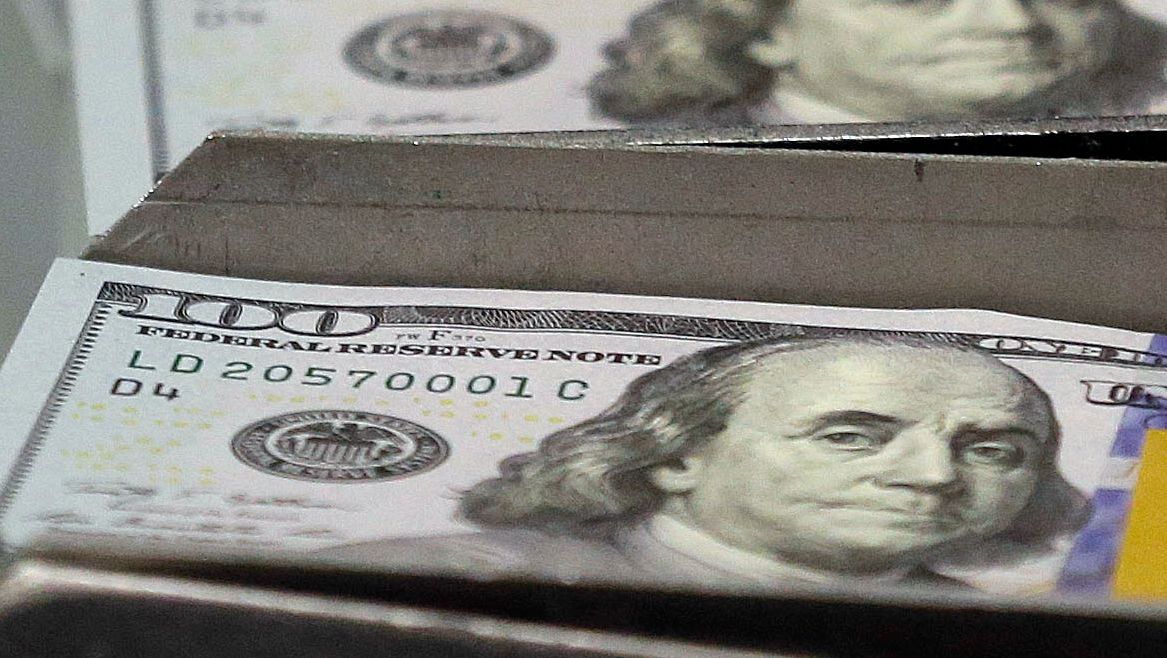 FILE - In this Sept. 24, 2013, file photo, freshly-cut stacks of $100 bills make their way down the line at the Bureau of Engraving and Printing Western Currency Facility in Fort Worth, Texas. Borrowing money from family can create an awkward situation. Setting up a loan agreement can make it easier to avoid hurt feelings and disputes down the road. (AP Photo/LM Otero, File)