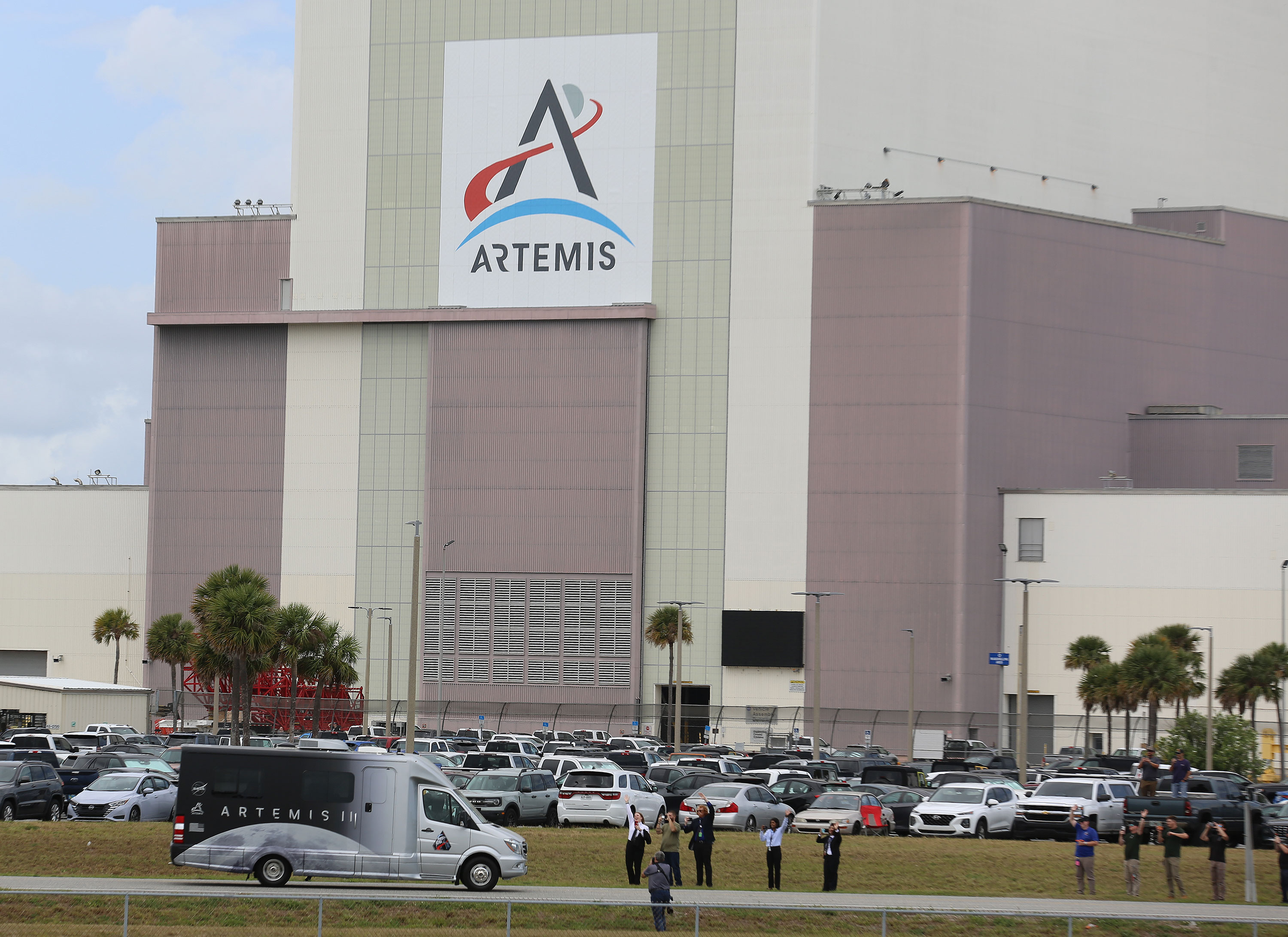 The Artemis II astronauts ride in the Astrovan on their...