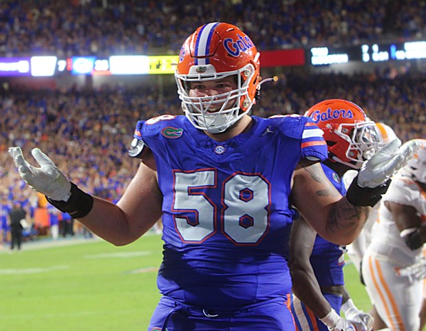 Florid Gatora offensive lineman Austin Barber celebrates a touchdown by running back Montrell Johnson Jr., during the Gators 2023 win against Tennessee at Ben Hill Griffin Stadium in Gainesville. (Chris Hays/Orlando Sentinel)