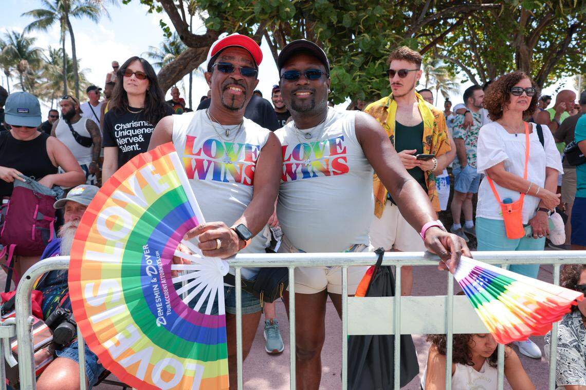 Brenton Bartley, left, and Darion Palmer, right, attend to the 18th annual pride parade in Miami Beach, Florida, Sunday, April 12, 2026.