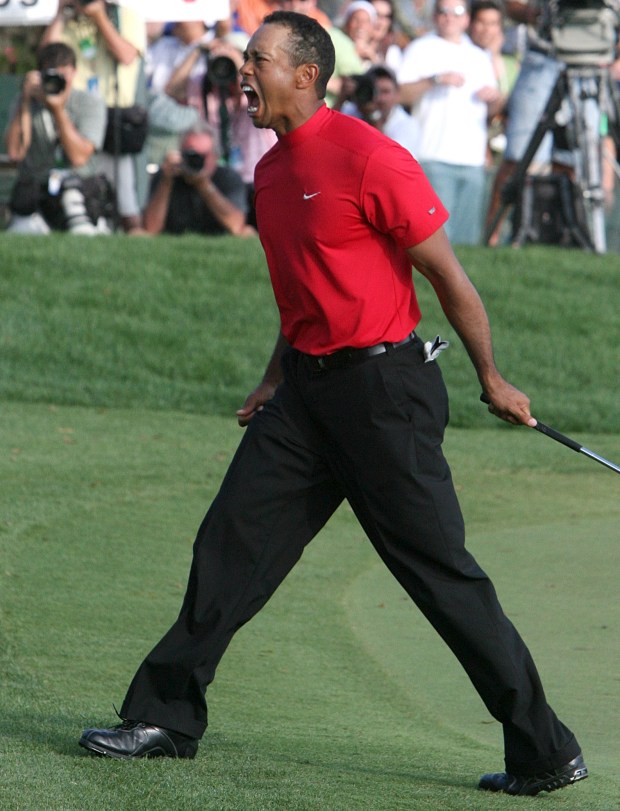 Tiger Woods celebrates his winning birdie putt on the 18th hole to win the 2008 Arnold Palmer Invitational at the Bay Hill Club and Lodge in Orlando. (Gary W. Green/Orlando Sentinel) 