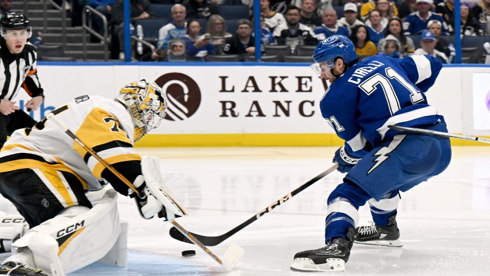 Tampa Bay Lightning center Anthony Cirelli (71) scores against Pittsburgh Penguins goaltender Stuart Skinner (74) during the second period of an NHL hockey game, Thursday, April 2, 2026, in Tampa, Fla. (AP Photo/Jason Behnken)