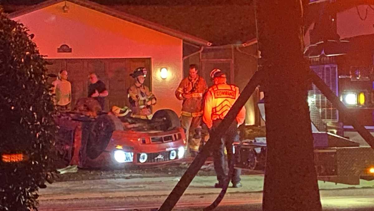 Rollover crash in Cape Coral leaves car upside down in front of a home