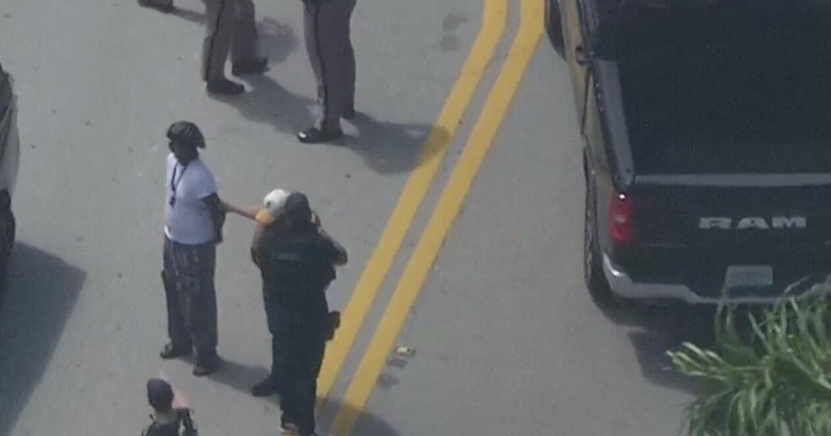 Police pursuit ends in Miami with at least one person seen in handcuffs