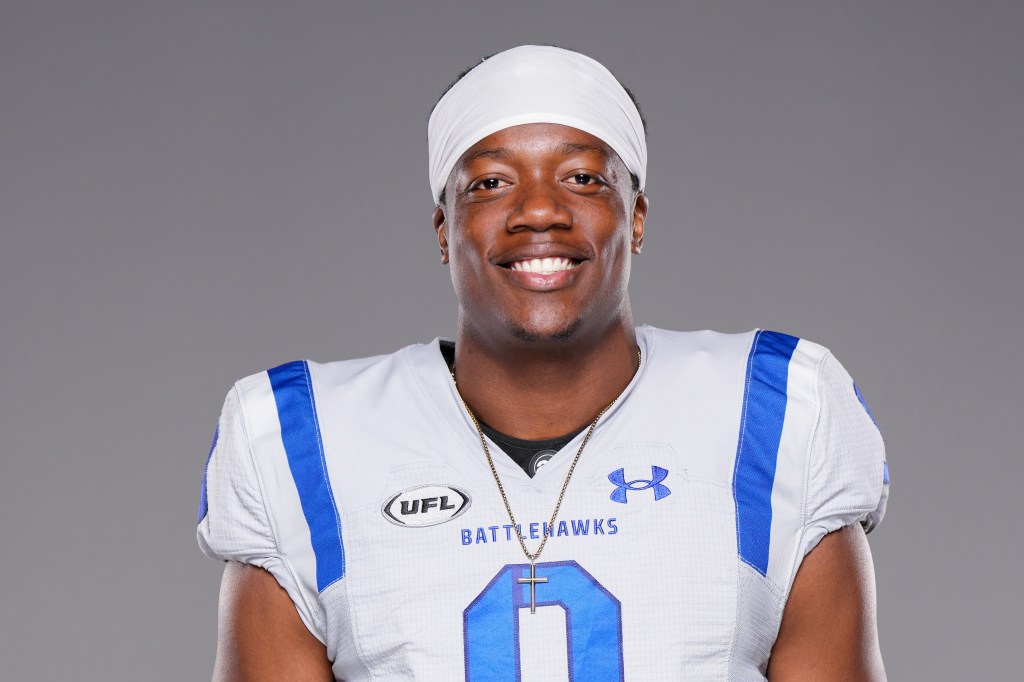 Chris Payton-Jones in a white football jersey with blue accents and the UFL logo.
