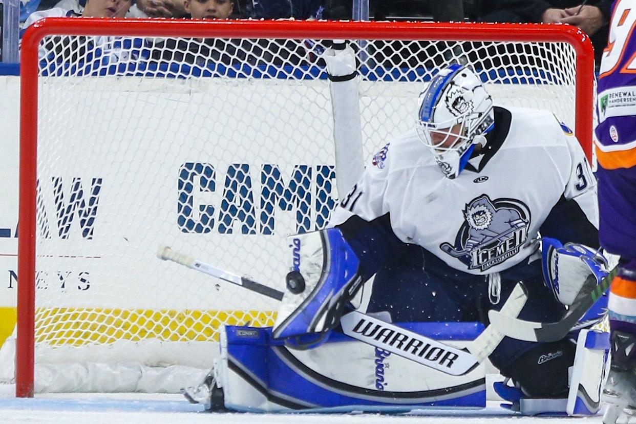Jacksonville Icemen goaltender Cameron Rowe (31) blocks a Orlando Solar Bears' shot on goal.