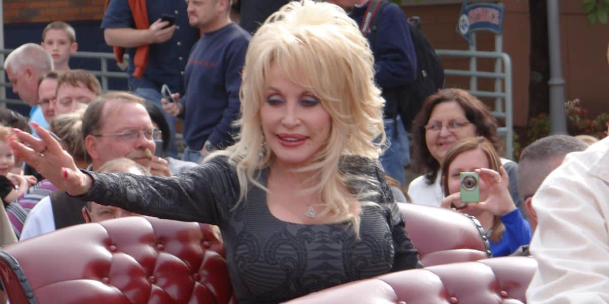 Dolly Parton rides in a parade at Dollywood.