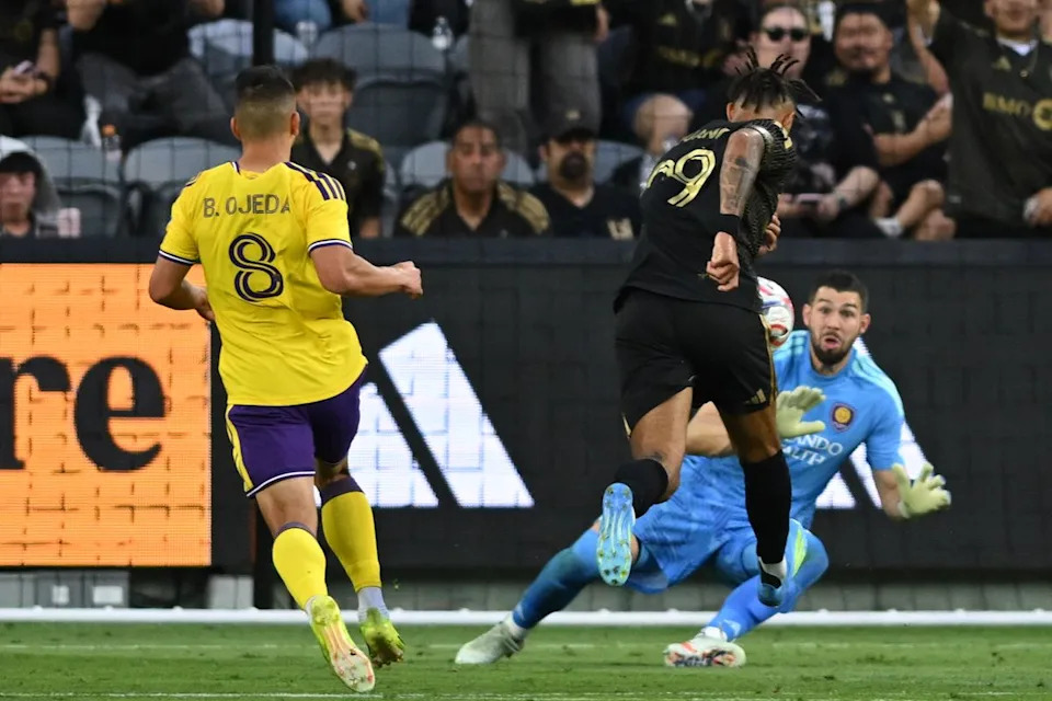 LAFC forward Denis Bouanga (99) kicks the ball past the keeper and scores a goal during an MLS game between LAFC and Orlando City SC on Saturday, April 4, 2026 at BMO Stadium in Los Angeles Calif