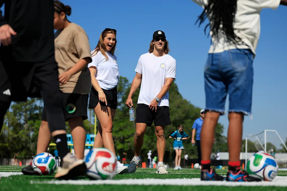 Jacksonville Jaguars quarterback Trevor Lawrence and wife Marissa Lawrence watch during a joint football-soccer camp at KIPP Bold City High School, Saturday, April 25, 2026, in Jacksonville, Fla. The two hosted the one-and-a-half-hour youth sports camp.