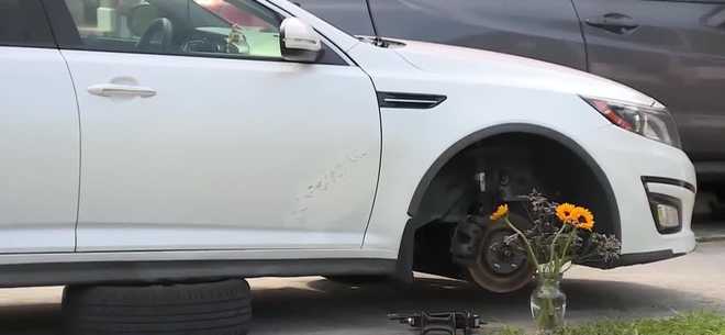 Police say a man died Saturday night in the 300 block of West 27th Street after a car fell on him while he was changing a tire.