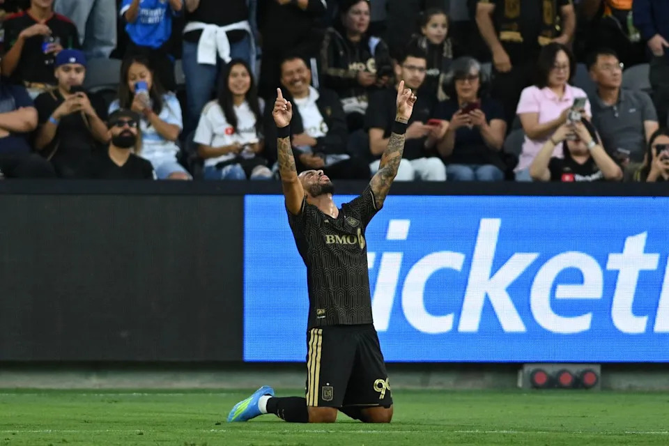 LAFC forward Denis Bouanga (99) gets down on his knees in celebration after scoring a goal during an MLS game between LAFC and Orlando City SC on Saturday, April 4, 2026 at BMO Stadium in Los Angeles Calif