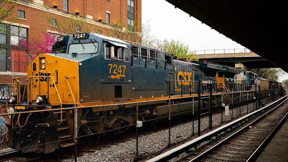 A CSX Transportation freight train stopped near the Brookland-Catholic University WMATA metro stop in Washington, D.C.