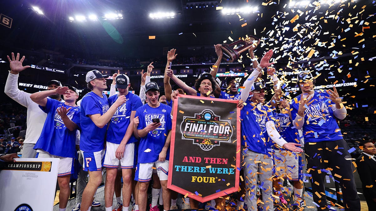 Florida Gators basketball players celebrating on court at Chase Center