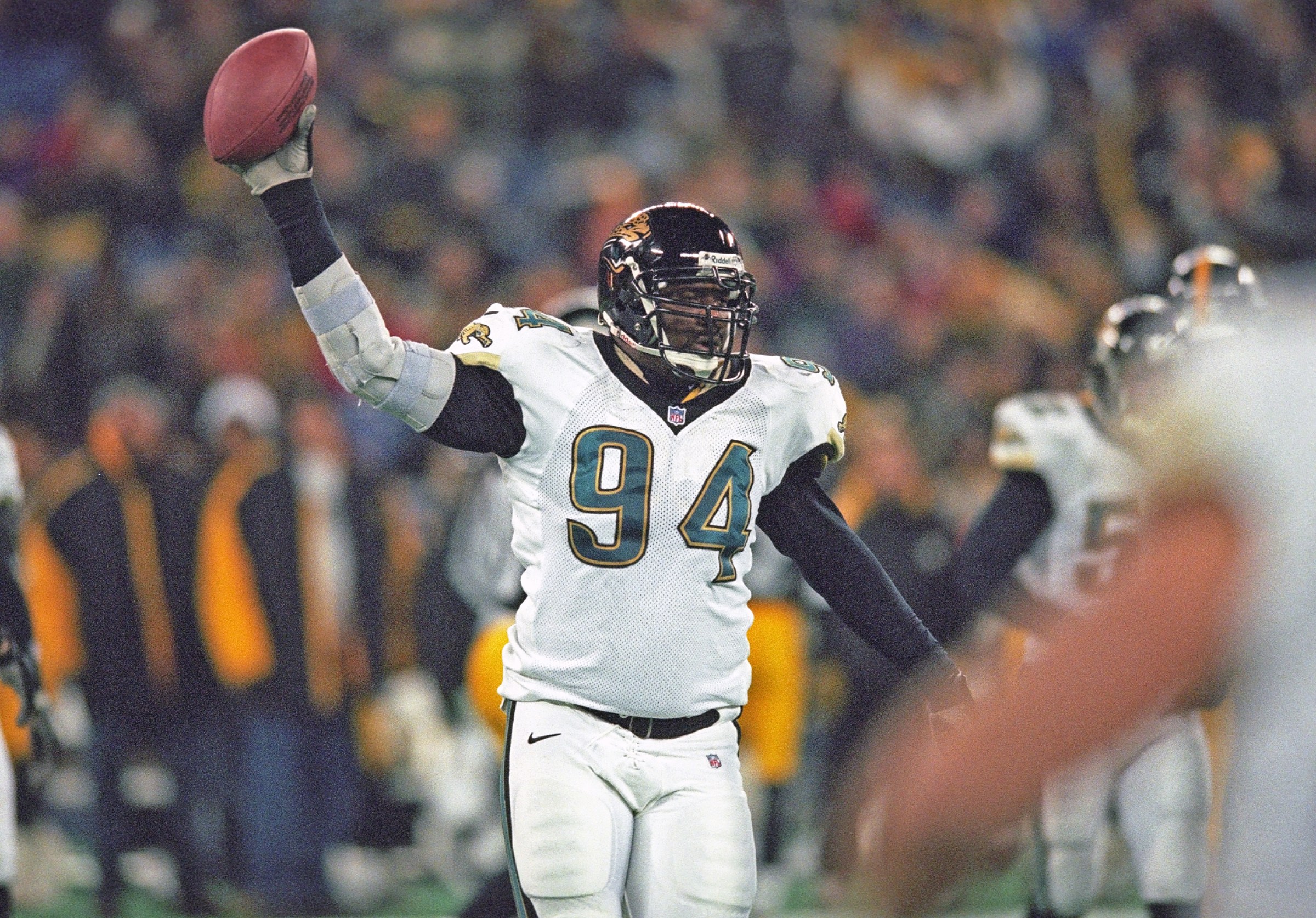 PITTSBURGH, PA - NOVEMBER 19: Defensive lineman Larry Smith #94 of the Jacksonville Jaguars holds the football after recovering a fumble by quarterback Kordell Stewart (not shown) of the Pittsburgh Steeelers during a game at Three Rivers Stadium on November 19, 2000 in Pittsburgh, Pennsylvania. The Jaguars defeated the Steelers 34-24. (Photo by George Gojkovich/Getty Images)