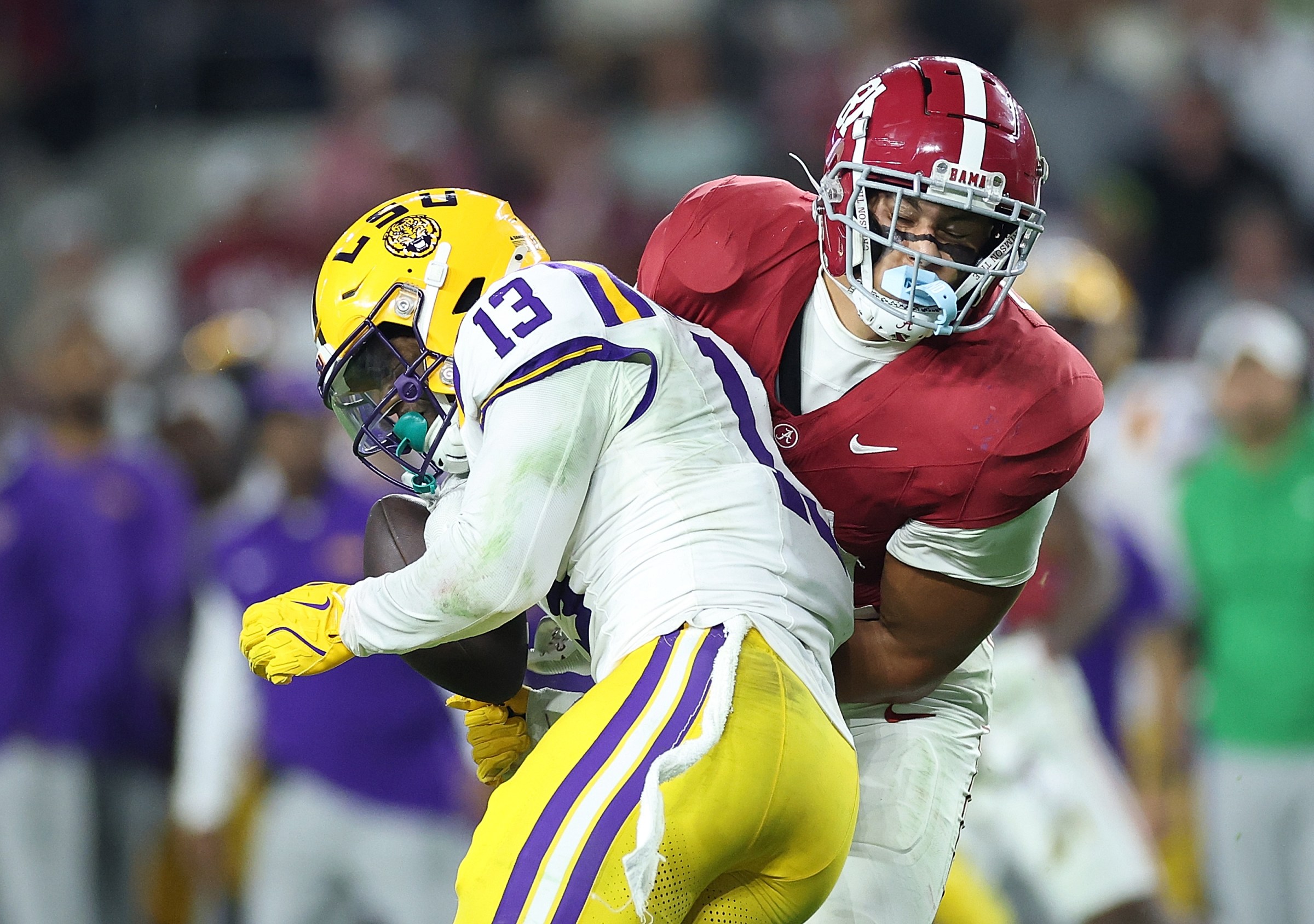 TUSCALOOSA, ALABAMA - NOVEMBER 08: A.J. Haulcy #13 of the LSU Tigers breaks up this reception intended for Kaleb Edwards #81 of the Alabama Crimson Tide during the fourth quarter at Bryant-Denny Stadium on November 08, 2025 in Tuscaloosa, Alabama. (Photo by Kevin C. Cox/Getty Images)
