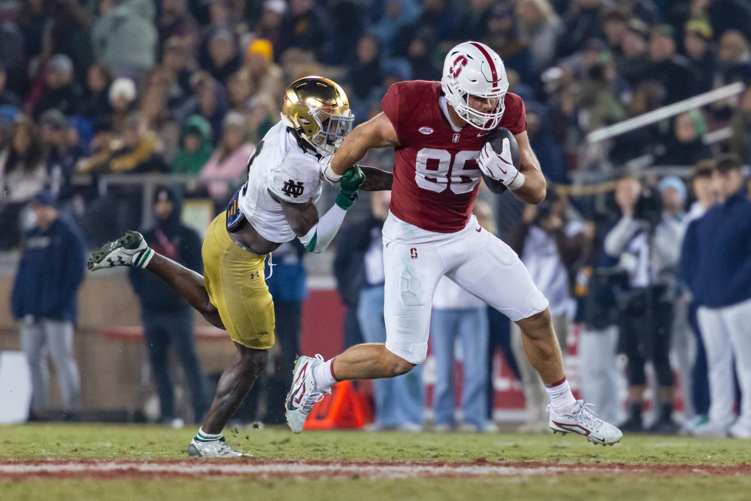 PALO ALTO, CA - NOVEMBER 29: Sam Roush #86 of the Stanford Cardinal runs past Adon Shuler #8 of the Notre Dame Fighting Irish during a game on November 29, 2025 at Stanford Stadium in Palo Alto, CA. (Photo by Matthew Huang/Icon Sportswire via Getty Images)