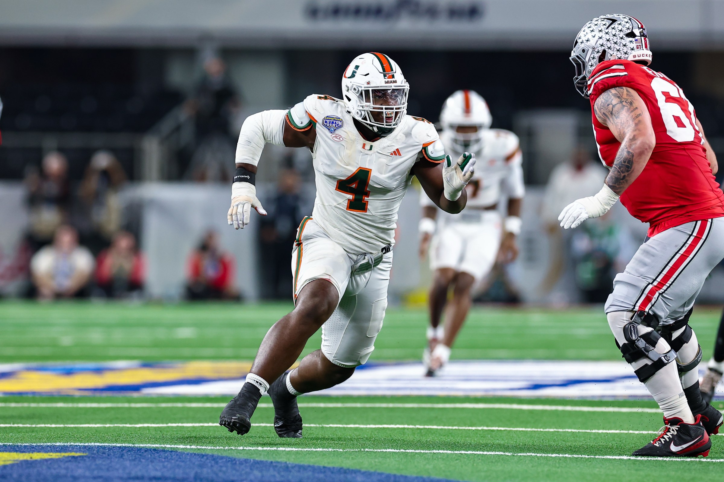 ARLINGTON, TX - DECEMBER 31: Miami Hurricanes defensive end Rueben Bain Jr. (#4) runs up field during the CFP Quarterfinal Cotton Bowl Classic football game between the Ohio State Buckeyes and Miami Hurricanes on December 31, 2025 at AT&T Stadium in Arlington, TX. (Photo by Matthew Visinsky/Icon Sportswire via Getty Images)