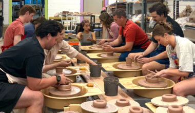 People molding clay