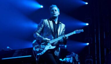 Photo of Jack White playing guitar