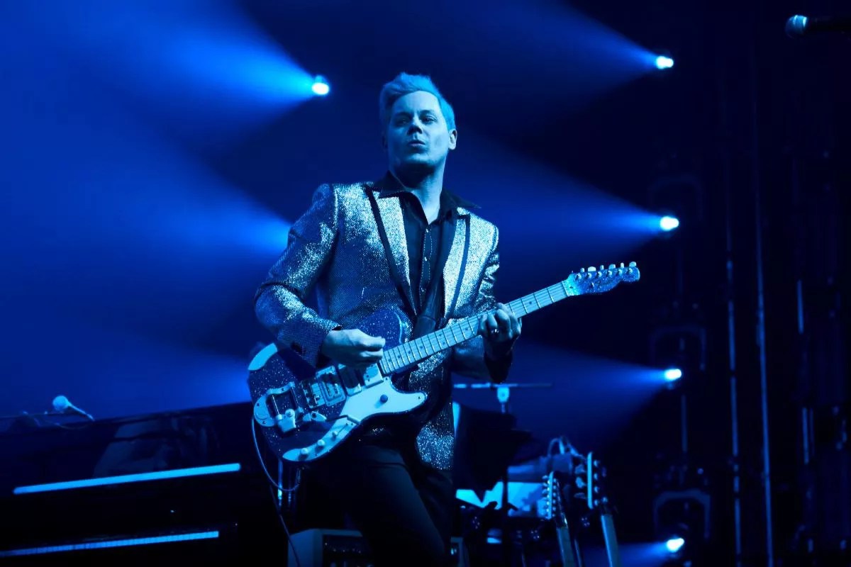 Photo of Jack White playing guitar