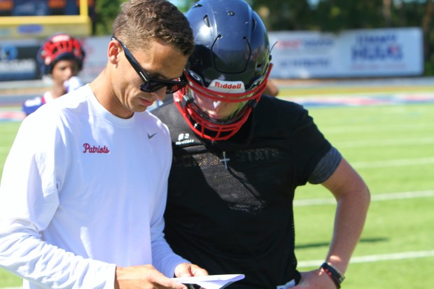 Lake Brantley coach Garrett Kruczek with 2028 quarterback Jackson Stecher. (Chris Hays/Orlando Sentinel)