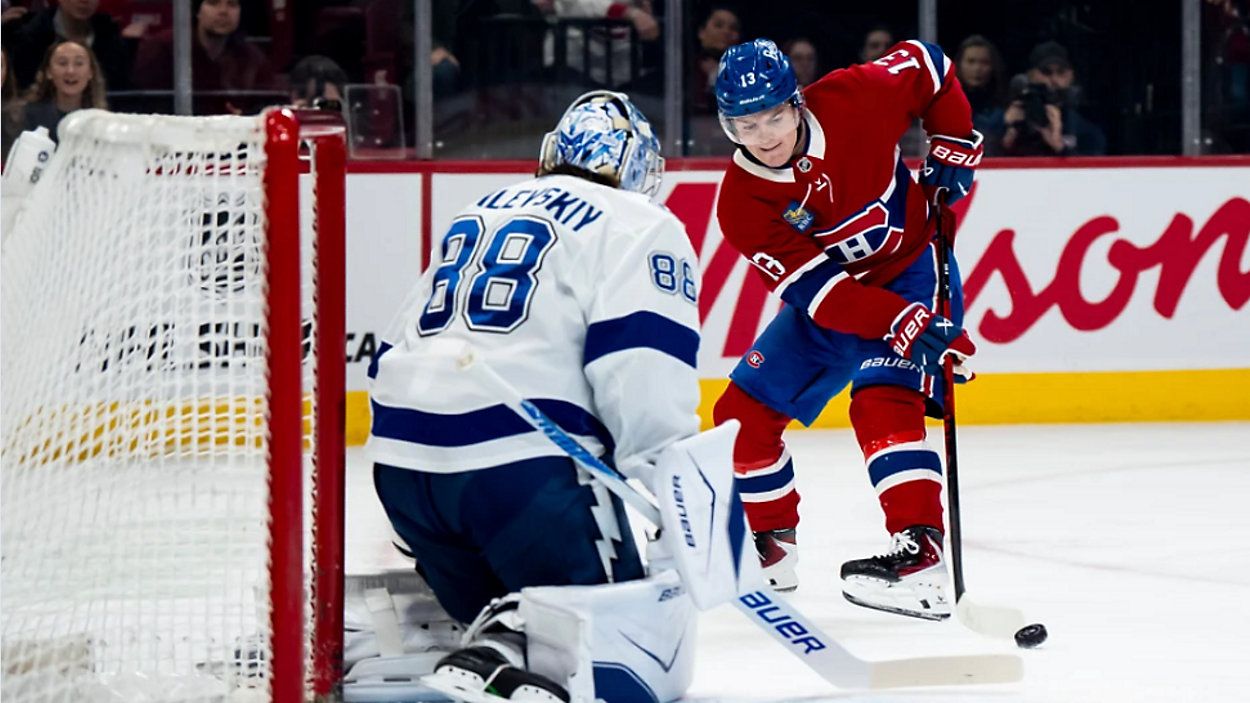 Tampa Bay Lightning goaltender Andrei Vasilevskiy (88) makes a save on Montreal Canadiens' Cole Caufield (13) during the first period of an NHL game, in Montreal, Thursday, April 9, 2026. (Christopher Katsarov/The Canadian Press via AP)