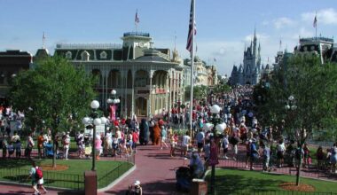 A large crowd walks along Main Street, U.S.A. at the Magic Kingdom.