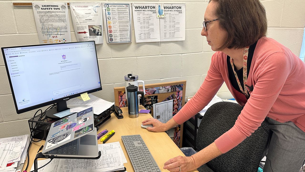 Teacher Kelly Whitton using "Magic School" AI. (Spectrum News)