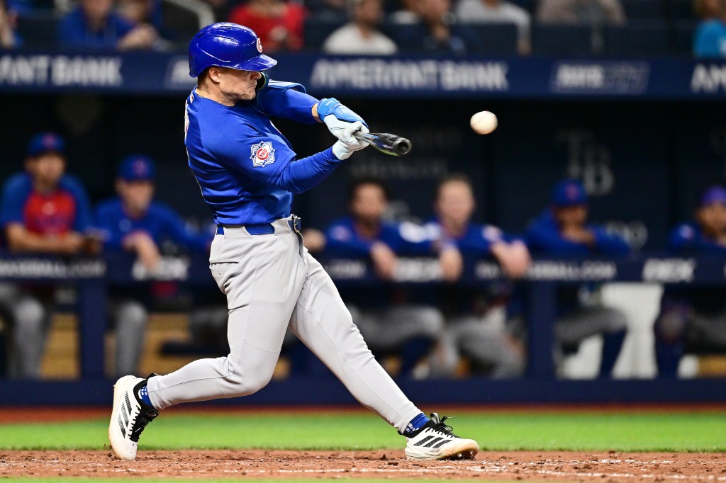 Matt Shaw of the Chicago Cubs hitting a single.