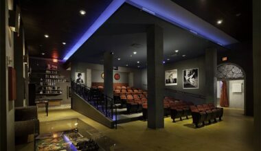 a small arthouse cinema with black-and-white film stills on the walls