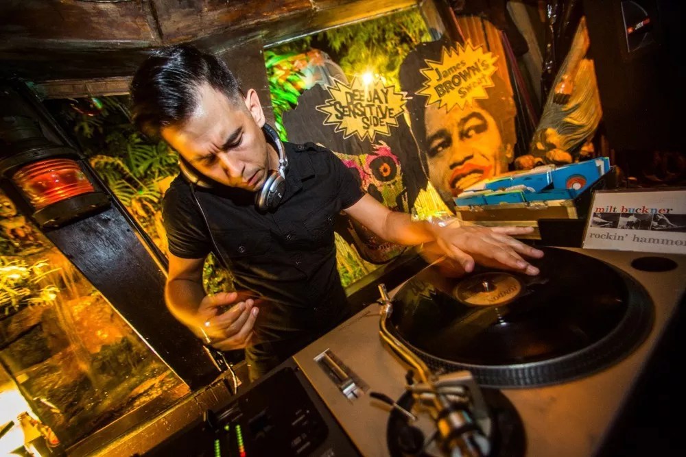 Photo of a DJ playing records. 