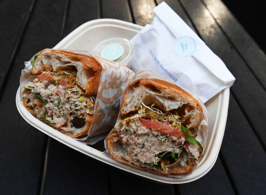 Tuna Sprout sandwich from Pura Vida Miami in a biodegradable container.